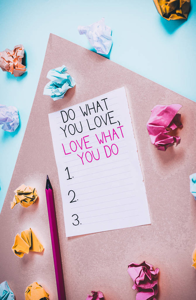 Conceptual hand writing showing Do What You Love Love What You Do. Concept meaning you able doing stuff you enjoy it to work in better places then Colored crumpled paper empty reminder blue yellow clothespin - Photo, Image