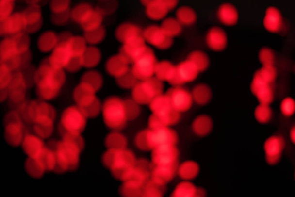 wallpaper patterned with round shaped red lights bokeh on black background - Φωτογραφία, εικόνα
