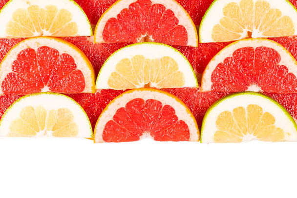 Pomelo en grapefruit schijfjes achtergrond.  - Foto, afbeelding