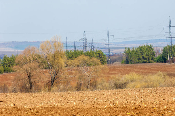 Spring landscape. energy pillars on the spring field. hilly terr - Valokuva, kuva