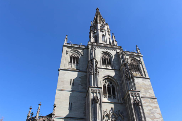 Historical Constance Cathedral (Konstanzer Muenster) isolated on blue sky in the city of Constance (Konstanz) in Baden-Wuerttemberg, Germany. - Photo, Image