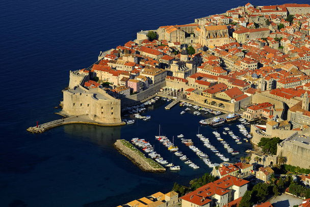 Dubrovnik - Old harbor. Picturesque view on the old town (medieval Ragusa) and Dalmatian Coast of Adriatic Sea. World Heritage Sites UNESCO of Croatia - Photo, Image