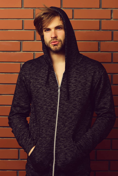 Confident look of young bearded guy wearing sportive hoodie - Foto, afbeelding