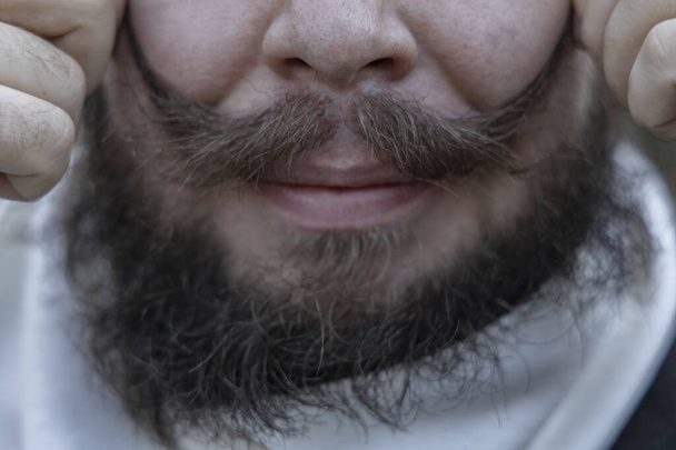 symmetrie hipster lange snor zachte focus wol textuur mannelijke gezicht lippen en mond - Foto, afbeelding