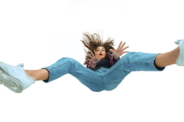 A second before falling - young girl falling down with bright emotions and expression - 写真・画像