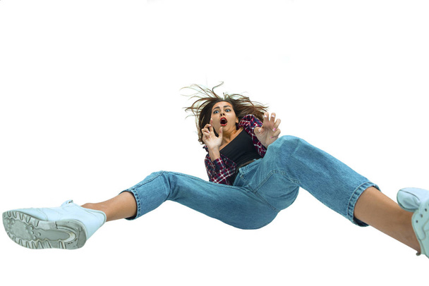 A second before falling - young girl falling down with bright emotions and expression - 写真・画像