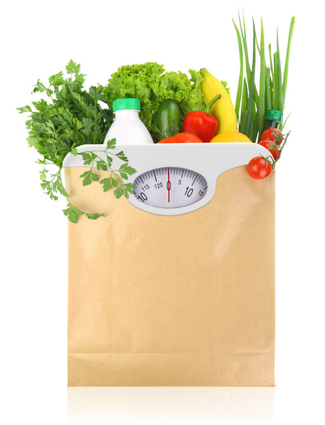 体重計を紙袋に新鮮な食料品をダイヤルします。 - 写真・画像