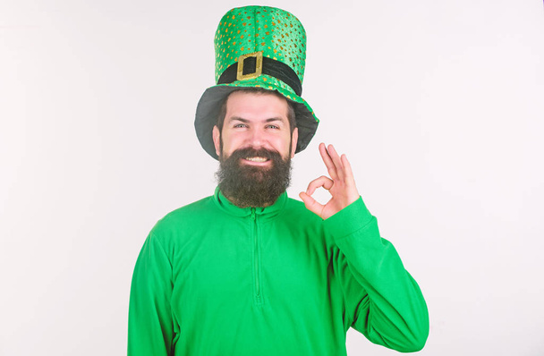 Everything is ok. Bearded man celebrating saint patricks day. Hipster in leprechaun hat and costume gesturing ok sign. Irish man with beard wearing green. Happy saint patricks day. Lets celebrate - Zdjęcie, obraz