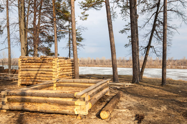 early spring, construction of wooden houses, the river ice. - Photo, Image