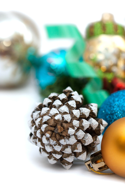 Christmas composition with pine cones and balls on a white background - Fotoğraf, Görsel