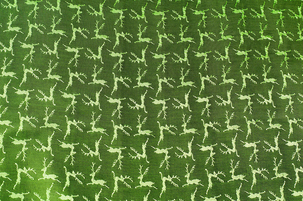 Fabric colors green, patterned texture deer.  - Photo, Image