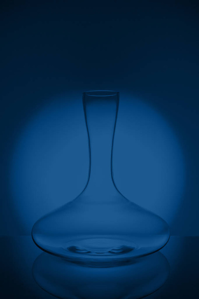 Luxury cristal decanter on classic blue background - Φωτογραφία, εικόνα