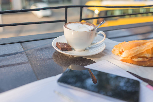 Peaceful morning with bread and hot cappuccino - Fotoğraf, Görsel