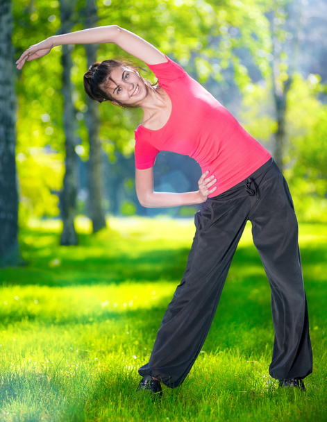 Stretching woman in outdoor sport exercise. - Foto, afbeelding