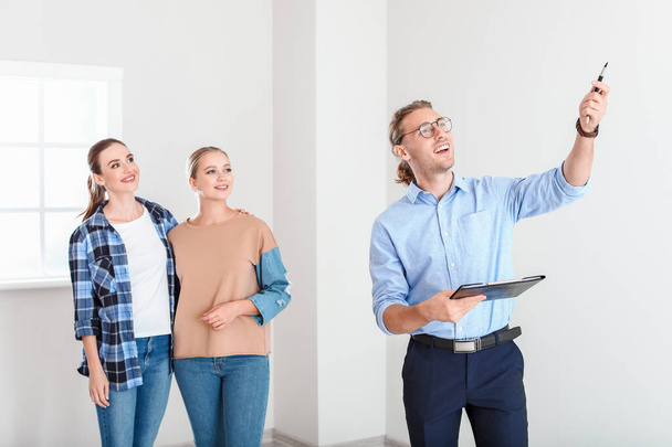 Real estate agent showing lesbian couple a new house - Photo, Image