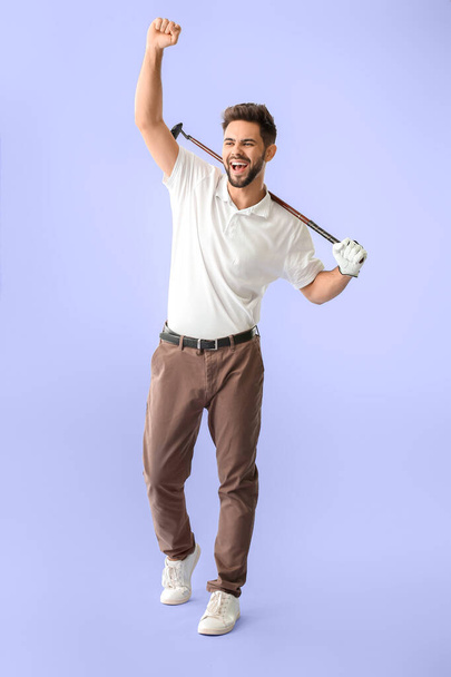 Handsome happy male golfer on color background - Photo, Image