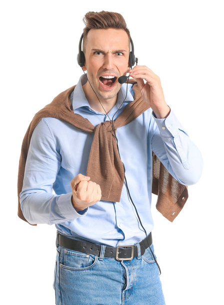 Angry male technical support agent on white background - 写真・画像