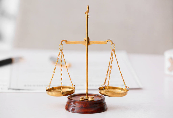 Scales of justice on lawyer's workplace - 写真・画像
