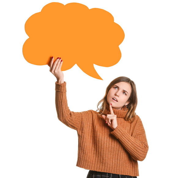 Thoughtful young woman with blank speech bubble on white background - Photo, Image