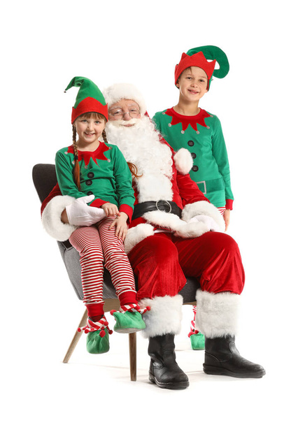 Santa Claus and little elf kids on white background - 写真・画像