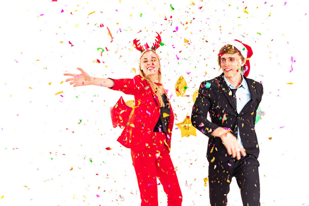 young couple enjoy dance with colorful confetti in new year celebration hangout party - Fotoğraf, Görsel
