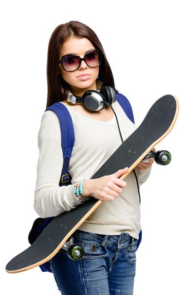 Teenager with skateboard - Foto, afbeelding