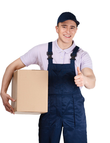 Workman in overalls hands a box - Zdjęcie, obraz