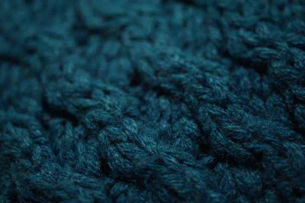Knitted texture, dark blue thread pattern, cozy winter background. - Foto, afbeelding