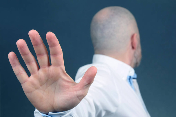 man negative hand gesture and turned away - Φωτογραφία, εικόνα