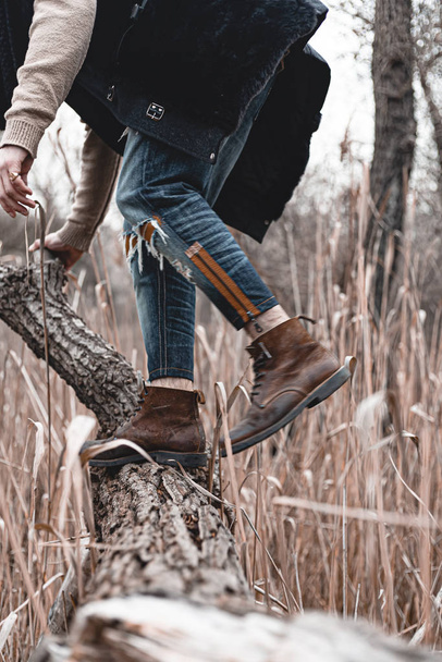 Guy hiking in comfortable hiking boots. Boots close-up stock photo. - Foto, Imagen
