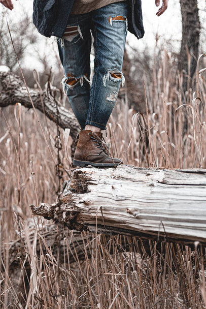 Guy hiking in comfortable hiking boots. Boots close-up stock photo. - Foto, Bild