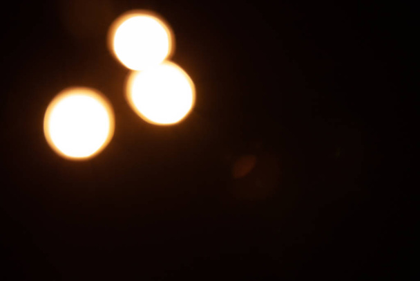 Orange bokeh of warm light bulbs without focus, defocus - Photo, Image