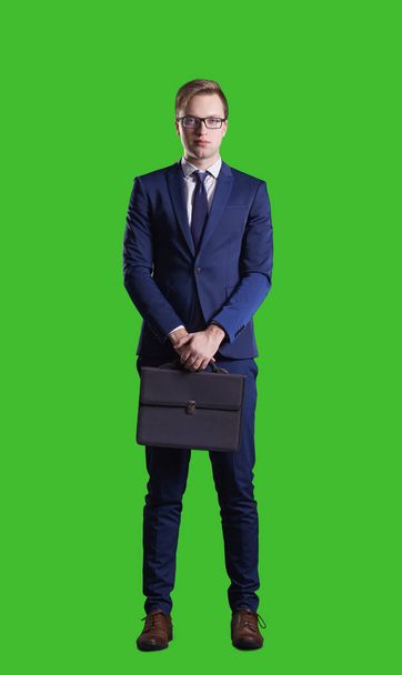 Businessman with briefcase standing over chroma key background. Business, career job concept. - Foto, Bild