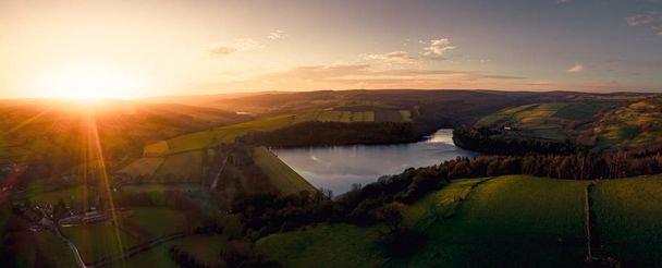 Beautiful aerial panorama view of Peak District National Park at sunset over Bradfield, Sheffield, UK in December 2019 - 写真・画像
