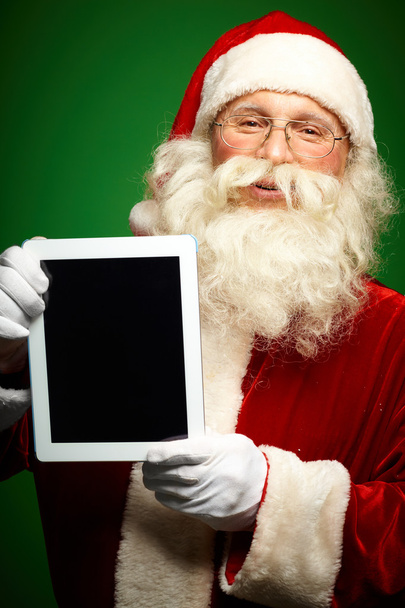 Santa with touchpad - Fotoğraf, Görsel