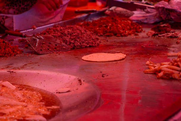 street tacos and french fries being cooked in a street market - Photo, Image
