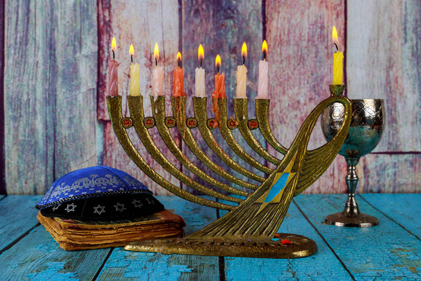 Chanukah candles all a jewish symbol with kosher wine celebration and kipah - Photo, Image