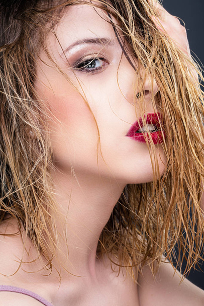 Close up of a young woman in profile, wet hair - 写真・画像
