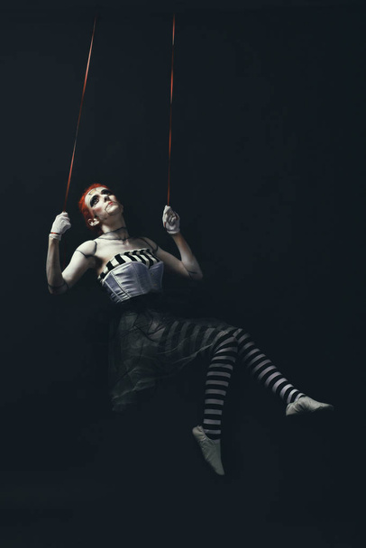 Young woman wearing makeup in dark doll - Foto, Bild