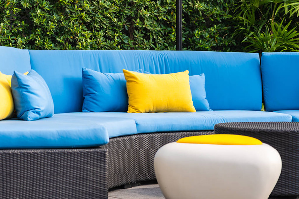 Outdoor patio in the garden with sofa chair and pillow decoratio - Photo, Image