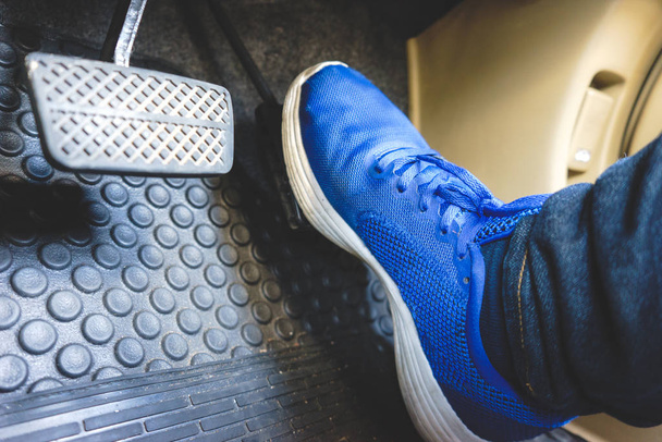 The gas pedal brake pedal on the blue shoes. - Foto, Imagem