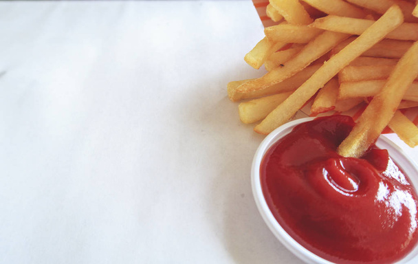 Close up French fries and tomato sauce - Фото, изображение