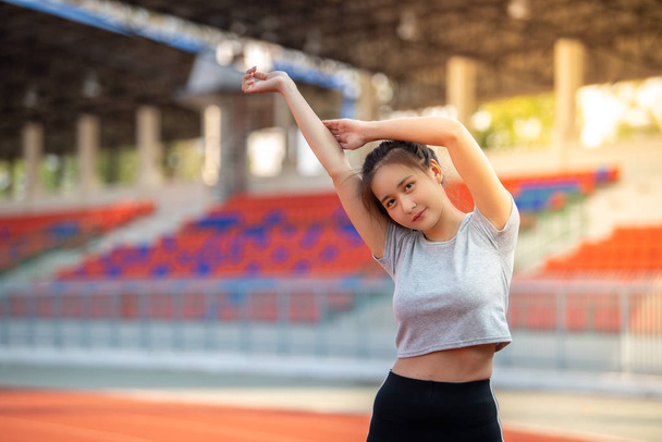Young Asian sports woman exercising in morning. - Fotografie, Obrázek