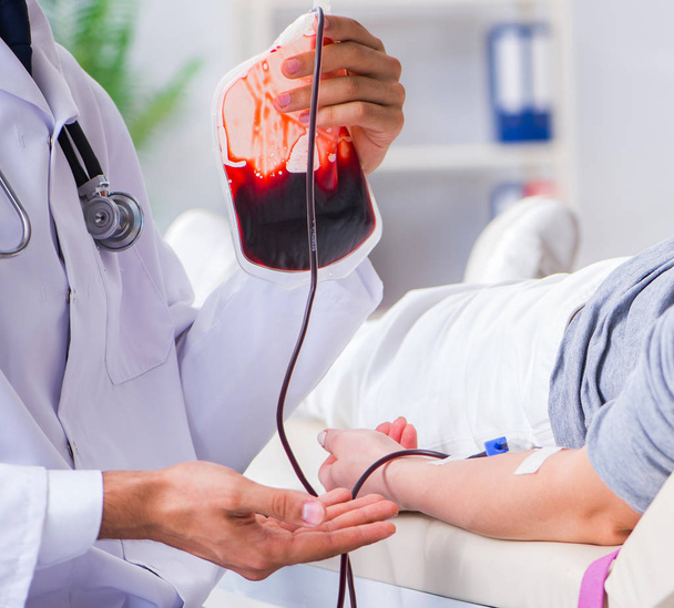Patient getting blood transfusion in hospital clinic - Фото, зображення