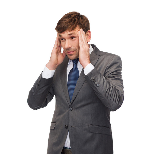 Stressed buisnessman or teacher having headache - Foto, afbeelding