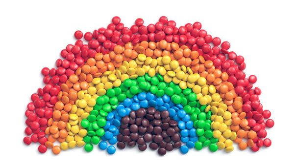 Colorful coated chocolate candies arranged as rainbow - Photo, Image