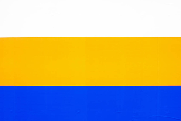 tricolor on a paper background as a symbol of art. White, yellow, blue - Photo, Image
