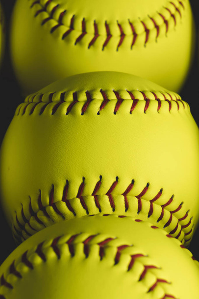 Fastpitch softball balls background close ups.  - Foto, imagen