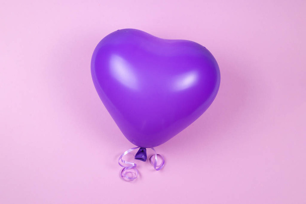 Purple ballon on purple background.  - Photo, image