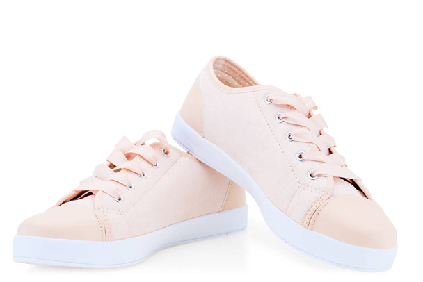 roze canvas canvas dames comfortabele schoenen op een witte achtergrond - Foto, afbeelding